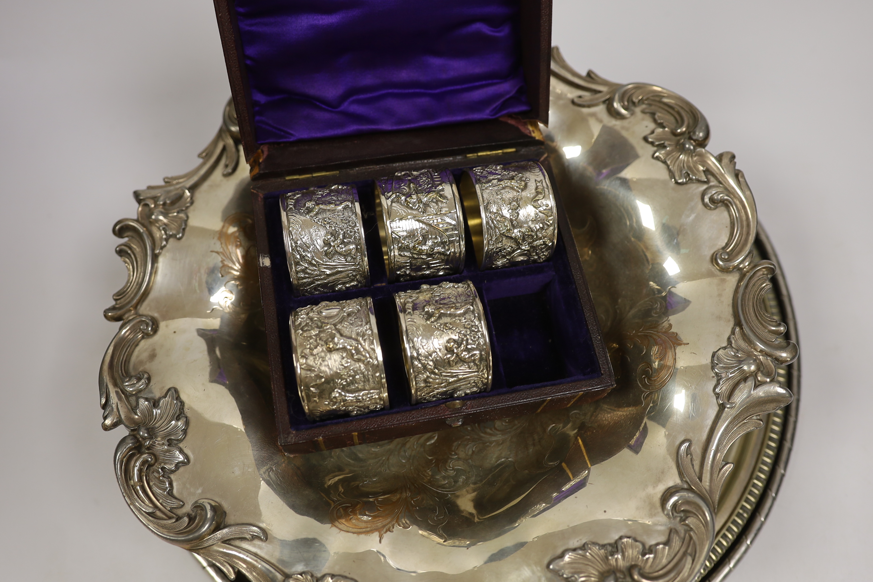 An Old Sheffield plate bowl, five cased napkin rings, and two salvers, largest 38cm diameter